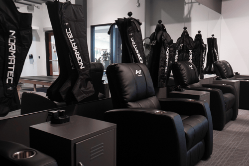 recovery space in fitness center, massage chairs