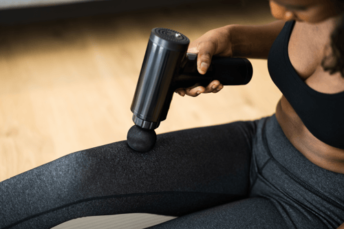 percussion massage therapy in a fitness center
